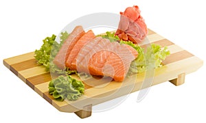 Fresh raw salmon fish pieces on plate isolated