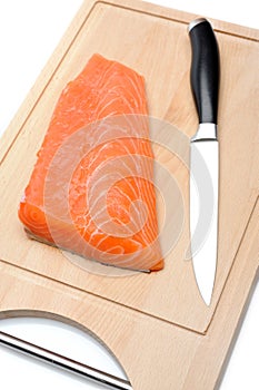 Fresh raw salmon fish on wooden board