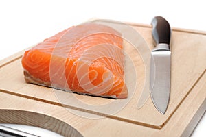 Fresh raw salmon fish on wooden board