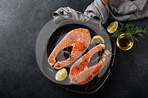 Fresh raw salmon steaks on grill pan ready for cooking