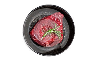 Fresh Raw sirloin rump steak in a skillet with herbs. Isolated on white background.