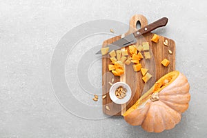 Fresh raw sliced butternut squash on wooden board, copy space for text