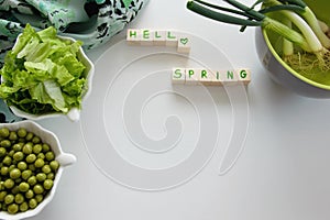 Fresh raw spring vegetables on white background