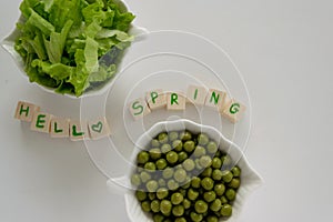 Fresh raw spring vegetables on white background