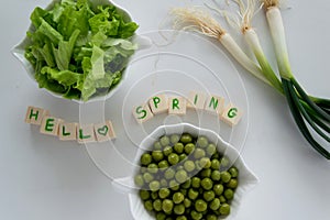 Fresh raw spring vegetables on white background