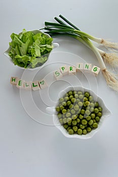 Fresh raw spring vegetables on white background