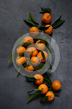 Fresh raw tangerine on dark background, healthy food ingredients