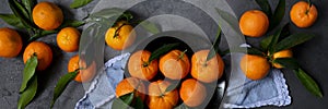 Fresh raw tangerine on dark background, healthy food ingredients