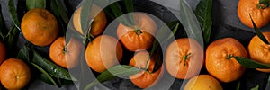 Fresh raw tangerine on dark background, healthy food ingredients