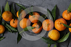 Fresh raw tangerine on dark background, healthy food ingredients