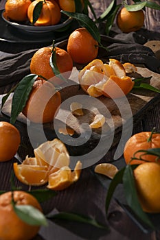 Fresh raw tangerine on dark background, healthy food ingredients