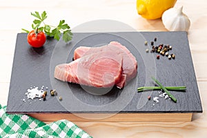Fresh raw tuna steaks with seasoning