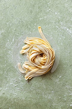 Fresh raw uncooked homemade twisted pasta tagliatelle