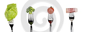 Fresh raw vegetable and meat food on forks