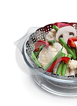 Fresh raw vegetables in steam basket. Ready for cooking