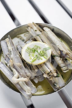 Fresh razor shell seafood steamed in garlic herb wine sauce