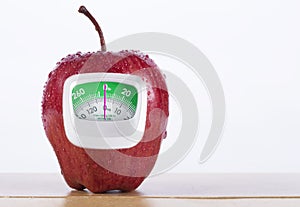 Fresh Red apple and green measurement meter