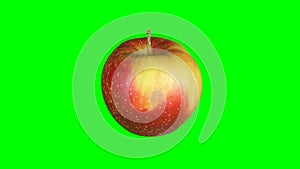 Fresh red apple isolated on green screen