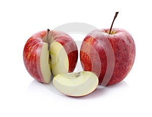 Fresh red apple with leaf and slice on awhite background