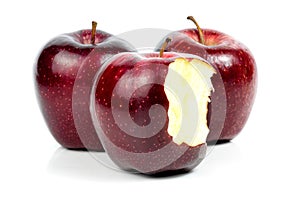 Fresh red apple nibble on white background