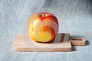 Fresh red apple on a wooden board. Cooking ingredient