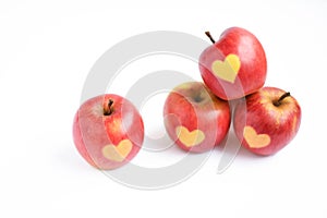 Fresh red apples with heart shape on it isolated on white background, healthy eating, health, holiday concept