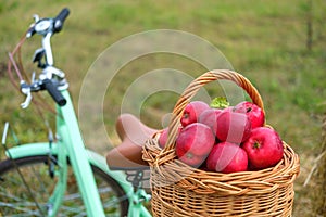 Fresh red apples in a wicker basket