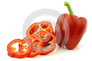 Fresh red bell pepper (capsicum) and a cut one