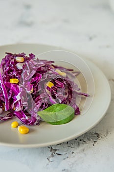 Fresh red cabbage salad with corn. Vegeterian and diet food