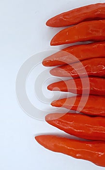 fresh red ceyenne pepper on a white background