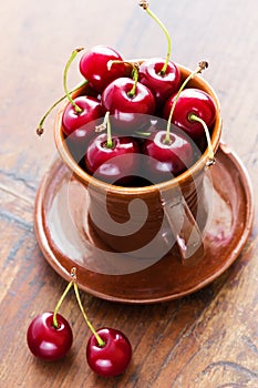 Fresh red cherries in bowl