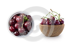 Fresh red cherries lay on white isolated background with copy space. Cherries in a bowl. Background of cherries. Ripe cherry on a