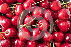 Fresh red cherries. Texture cherries fruits close up. Cherry fruit. Cherries with copy space for text. Top view.