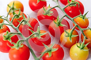 Fresh red cherry tomato on white background