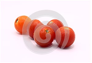 Fresh red cherry tomatoes on white background