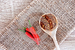 Fresh red chilli pepper and crushed dried red cayenne pepper with seeds , rich of antioxidant herbal food