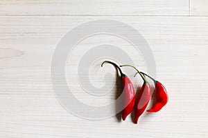 Fresh red Chilli peppers on the table.