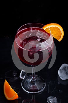Fresh red colorful alcoholic cocktail Sangria with lemon and ice