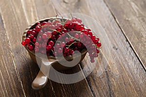 Fresh Red currants in a brown bowl