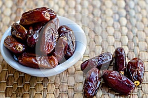 Fresh red dates hurma in bowl