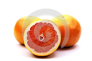 Fresh red grapefruit and grapefruit slices isolated on white bakground.Top view. Copy space. Healthy food, diet concept.