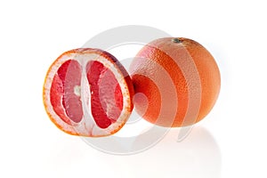 Fresh red grapefruit isolated on white