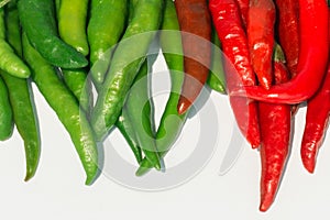 Fresh red and green chilli on white background