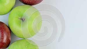 Fresh Red and greens apples on a white background. rotation