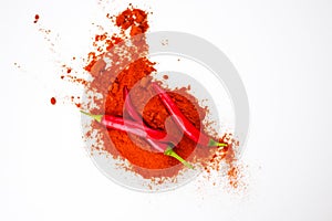 fresh red hot pepper and powder on a white background