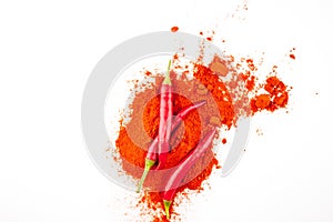 fresh red hot pepper and powder on a white background