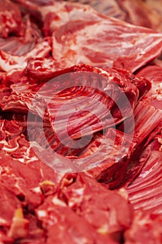 Fresh red meat on the market counter. Healthy eating. Close-up. Vertical