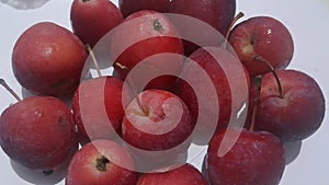 Fresh Red Mini Apples Close-Up on White Background