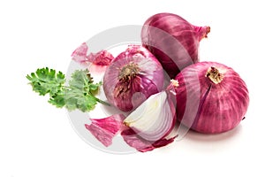 Fresh red onion sliced bulb and onion peel isolated on white background