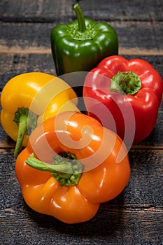 Fresh red, orange, green and yellow sweet bell paprika